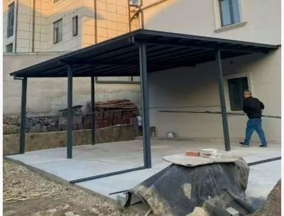 Installed all-aluminium canopy beside a house during handover