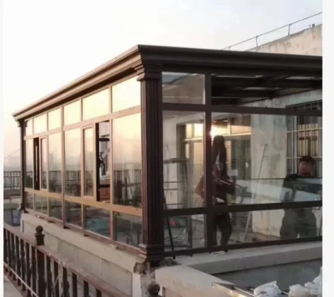 Installed bronze-frame aluminium sunroom on a balcony